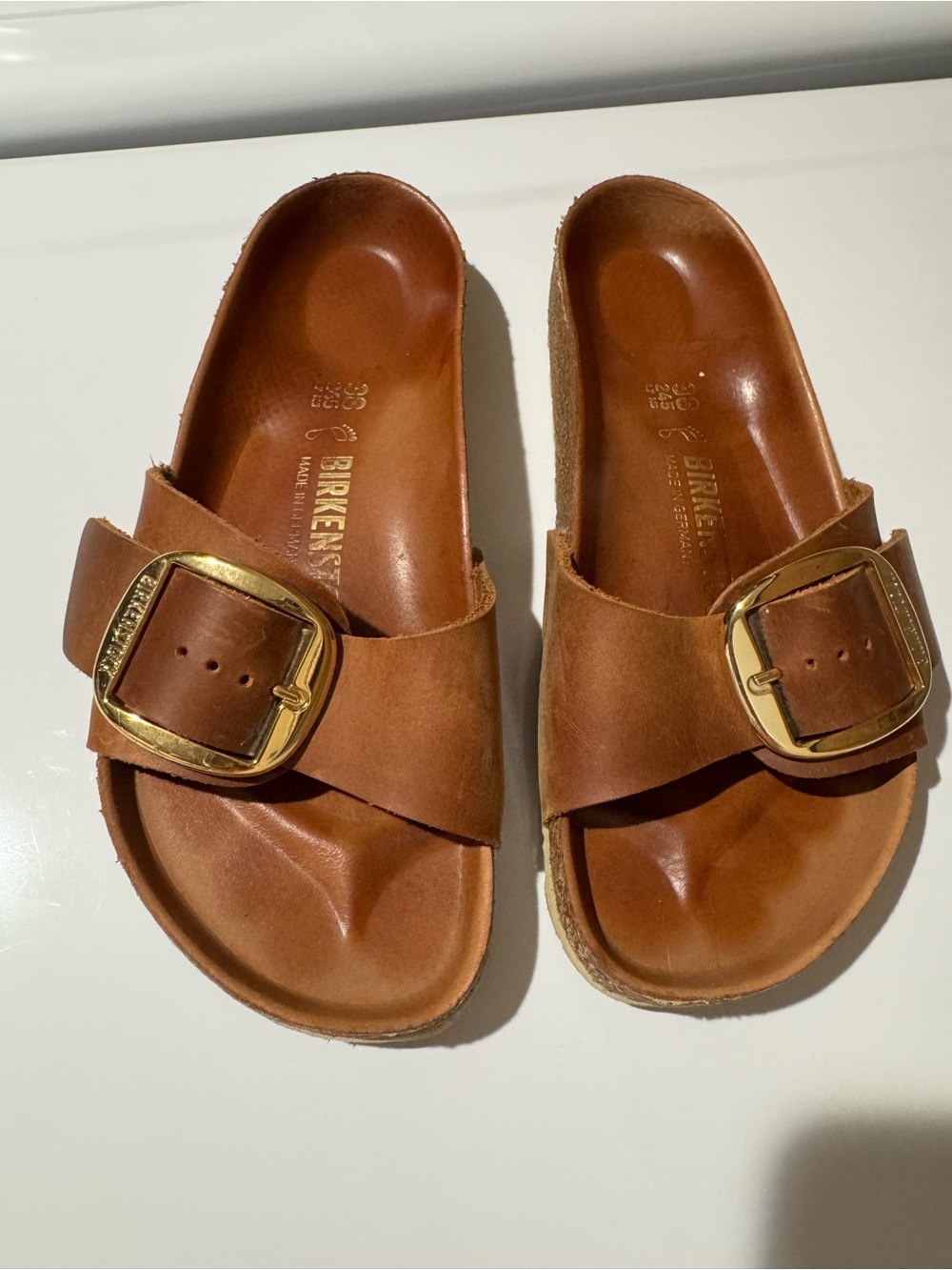 Birkenstock woman’s Tan Leather Slide with Gold Buckle